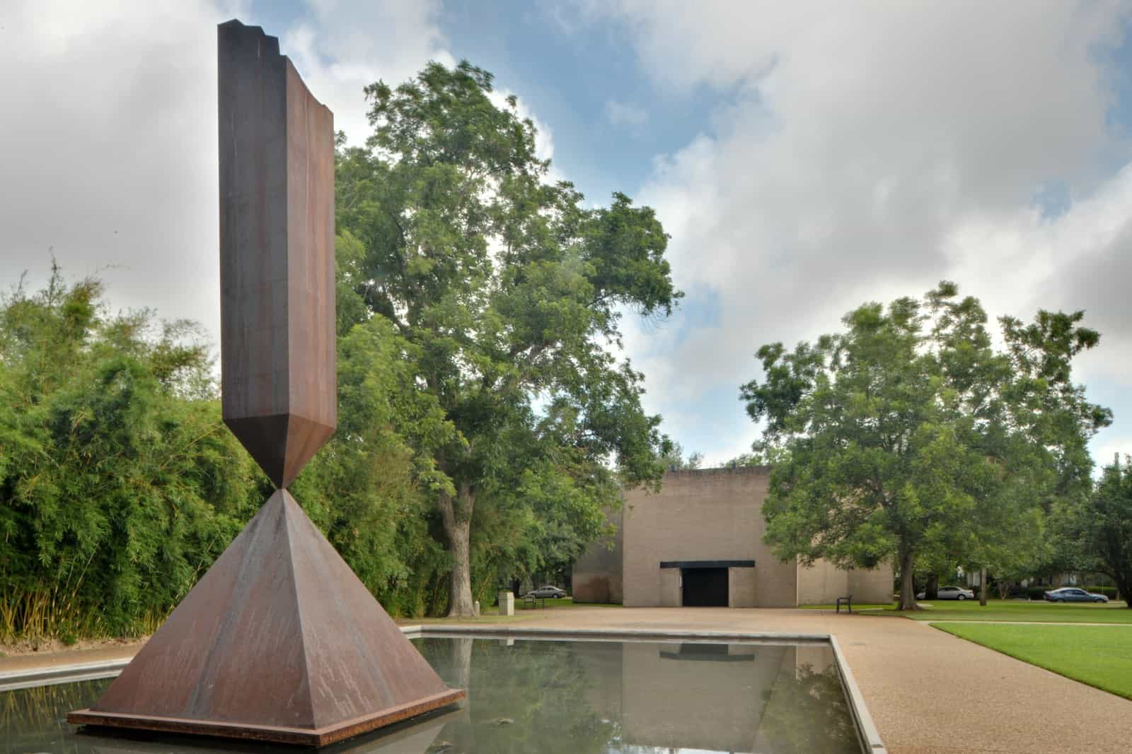 Barnett Newman Broken Obelisk Rothko Chapel (HDR). The outdoor sculpture, "Broken Obelisk" by Barnett Newman, is permanently installed in the reflecting pool on the grounds of Roth