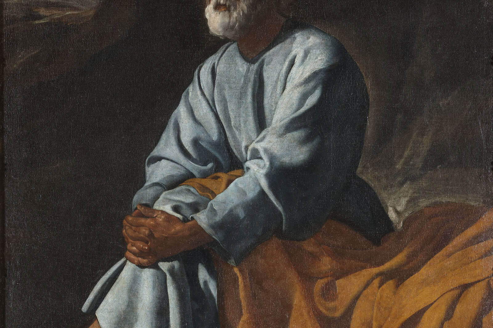 Der heilige Petrus blickt mit gefalteten Händen und Tränen in den Augen nach oben.